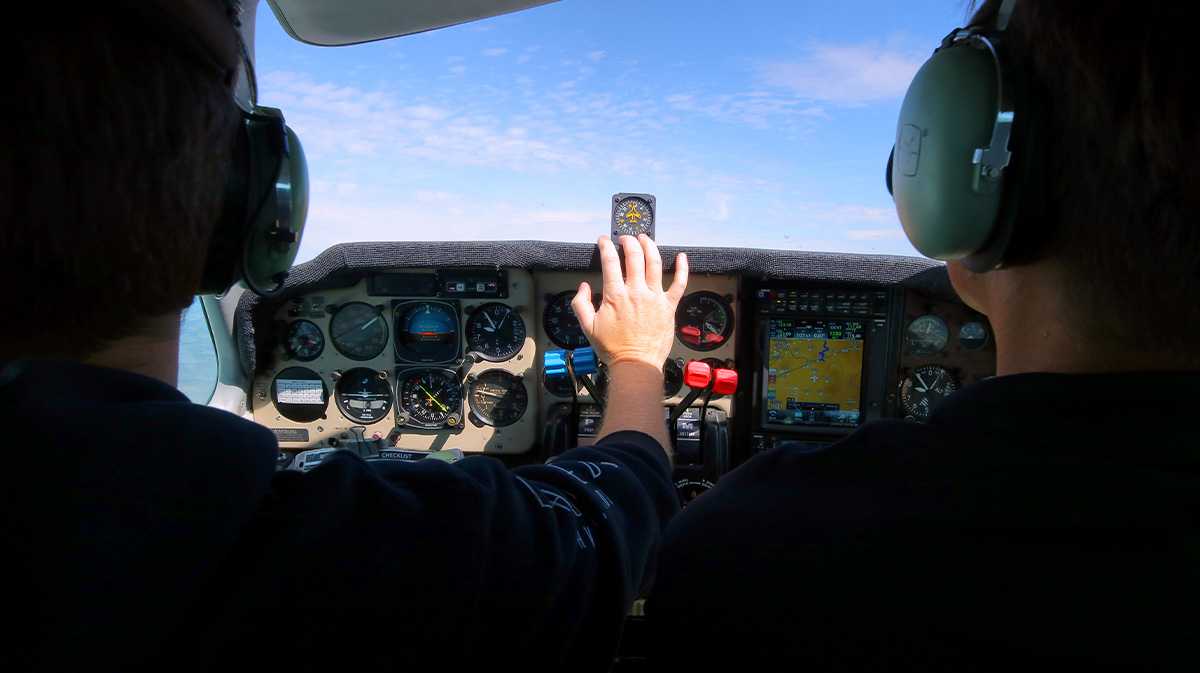 how much does flight school cost? two pilot POV flying in helicopter