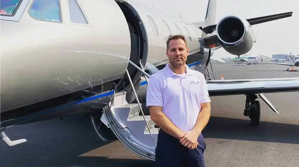 Pilot standing in front of plane for a blog about private aviation careers