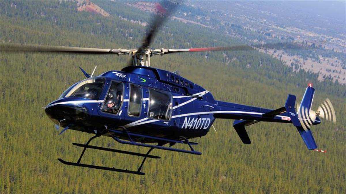 helicopter flying over mountain for a blog about critical infrastructures