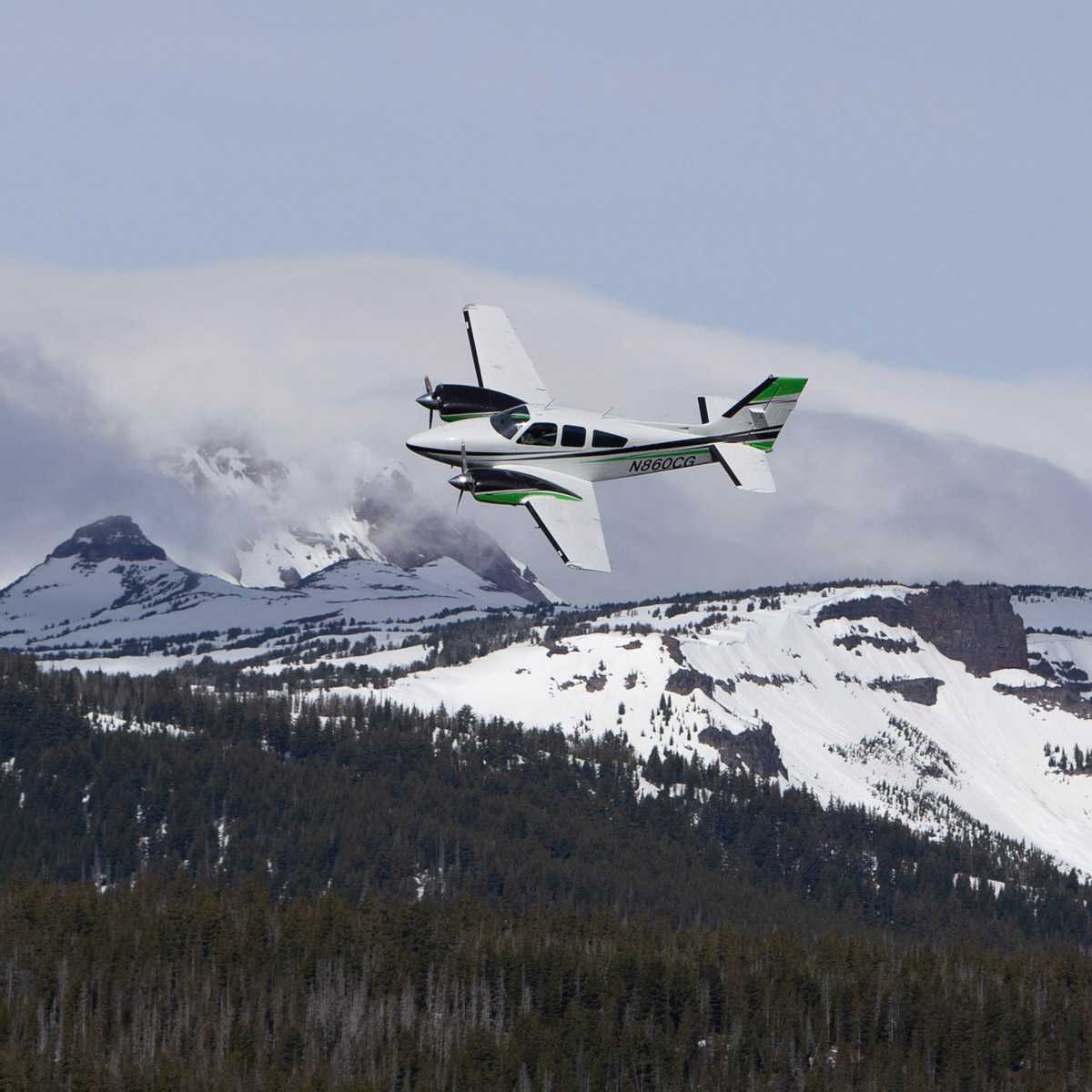 Leading Edge plane over snowy mountains
