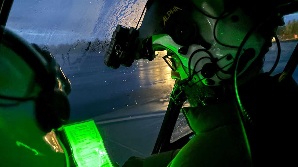 pilots in helicopter at night for a blog about helicopter flight course options